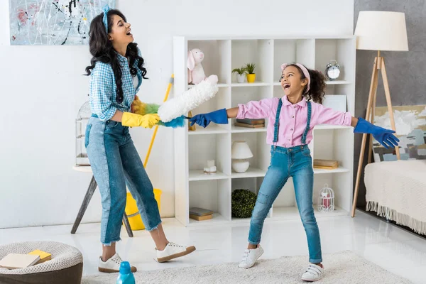 Laughing African American Mom Daughter Having Fun While Fighting Dusters — Stock Photo, Image