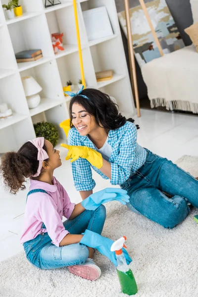 Happy African American Mother Touching Daughters Nose Tip Hand Yellow — Stock Photo, Image