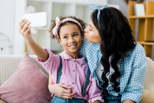 Cute African American Child Taking Selfie Kissing Hugging Mother — Stock Photo, Image