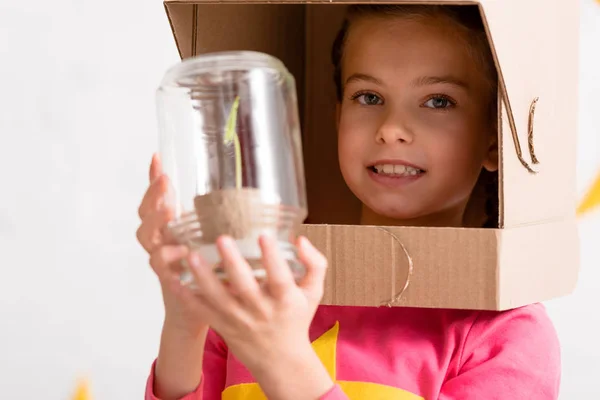 Excited Child Cardboard Helmet Holding Plant Jar — Stock Photo, Image