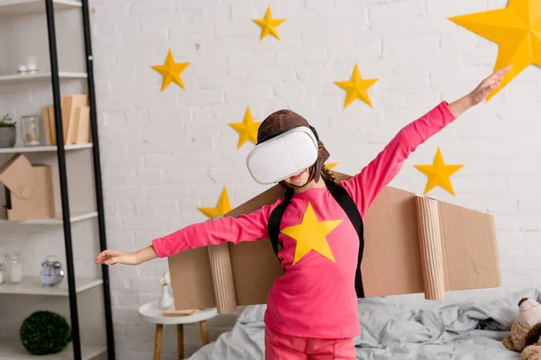 Kid Headset Cardboard Wings Waving Hands Bedroom — Stock Photo, Image