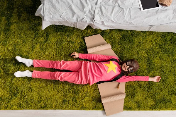 Top View Adorable Child Cardboard Wings Lying Carpet — Stock Photo, Image