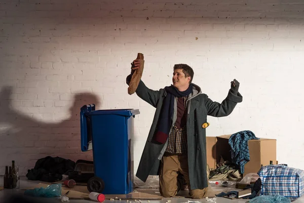 Homeless Man Standing Knees Holding Bread Baguette Raised Hand — Stock Photo, Image