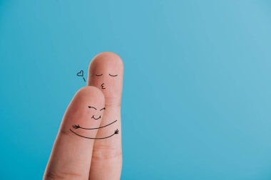 cropped view of happy couple of fingers hugging isolated on blue clipart