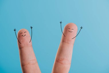 cropped view of excited smiling fingers isolated on blue clipart