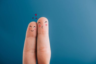 cropped view of smiling couple of fingers with hearts isolated on blue clipart