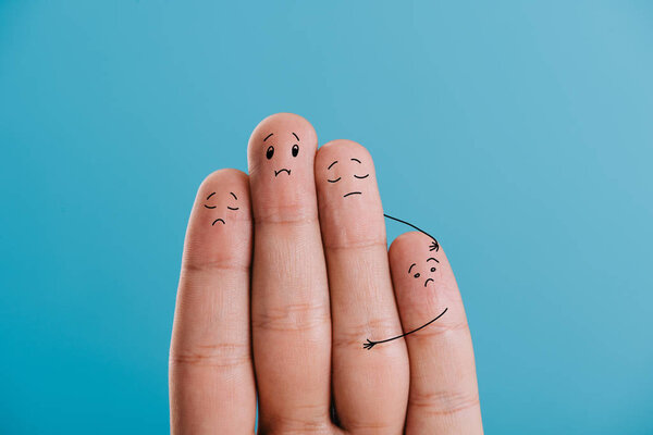 cropped view of upset fingers family isolated on blue