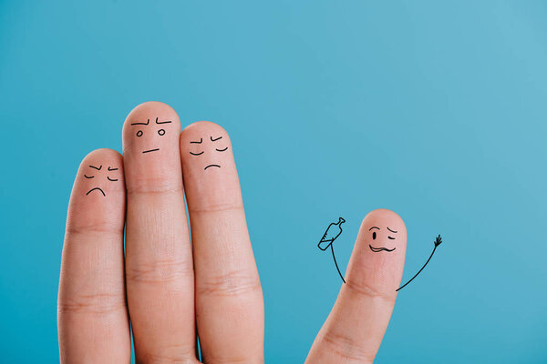 cropped view of fingers as frustrated people looking at drunk man isolated on blue