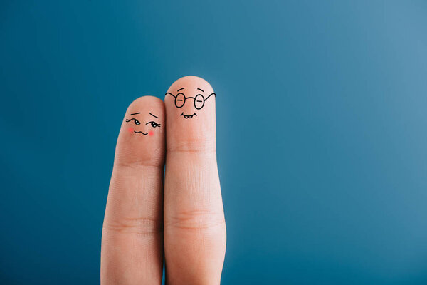 cropped view of happy couple of fingers isolated on blue
