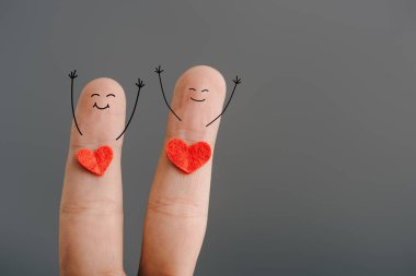 cropped view of happy couple of fingers with hearts isolated on grey, valentines day concept clipart