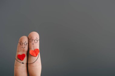 cropped view of happy couple of fingers with hearts hugging isolated on grey, valentines day concept clipart