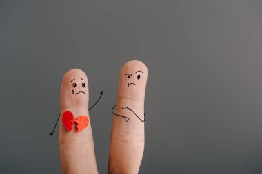 cropped view of fingers as couple with broken heart isolated on grey clipart