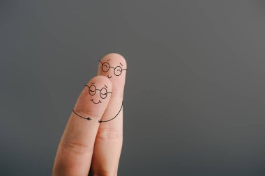 partial view of smiling couple of fingers hugging isolated on grey clipart