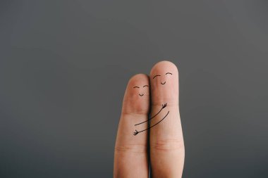 cropped view of happy couple of fingers embracing isolated on grey clipart