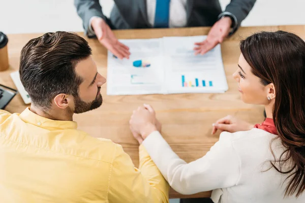 Selective Focus Investors Sitting Table Holding Hands While Advisor Showing — Stock Photo, Image
