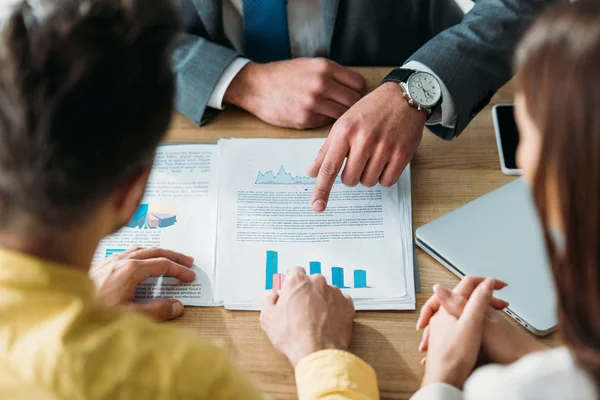 Cropped View Investors Sitting Table Holding Hands Wile Advisor Pointing — Stock Photo, Image