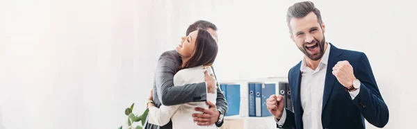 Colleagues Hugging Smiling Celebrating Office — Stock Photo, Image