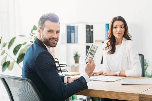Selective Focus Investor Holding Dollar Banknotes Advisor Looking — Stock Photo, Image