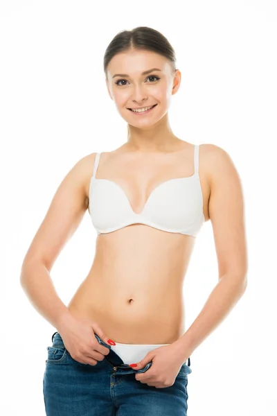 Smiling Slim Woman Underwear Taking Blue Jeans Isolated White — Stock Photo, Image