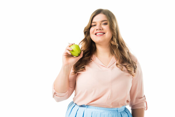 happy overweight woman holding green apple isolated on white