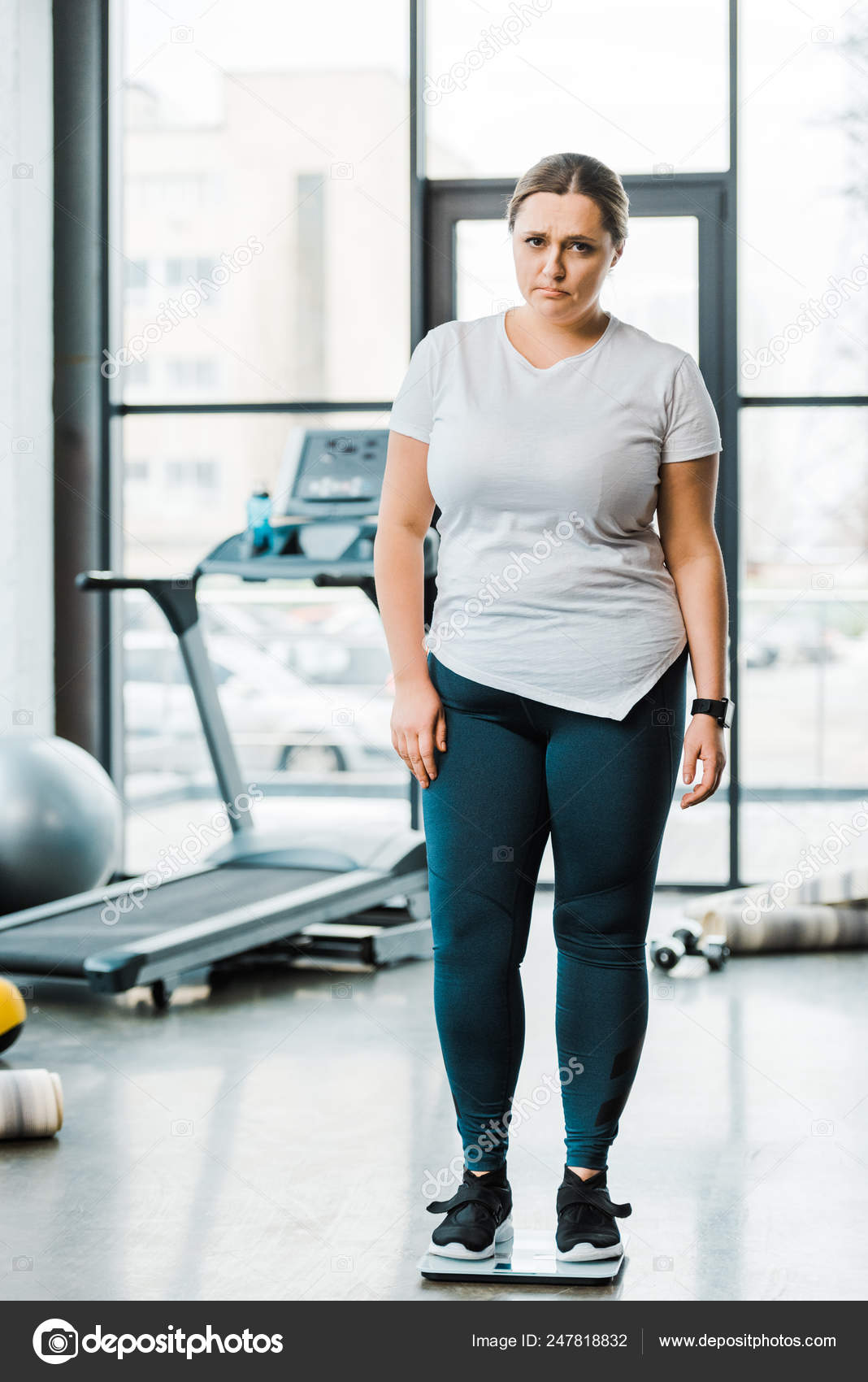 Upset Overweight Woman Standing Scales Gym Stock Photo AndrewLozovyi 247818832