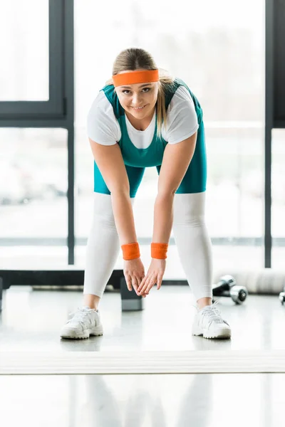 Cheerful Overweight Woman Stretching Sportswear Gym — Stock Photo, Image