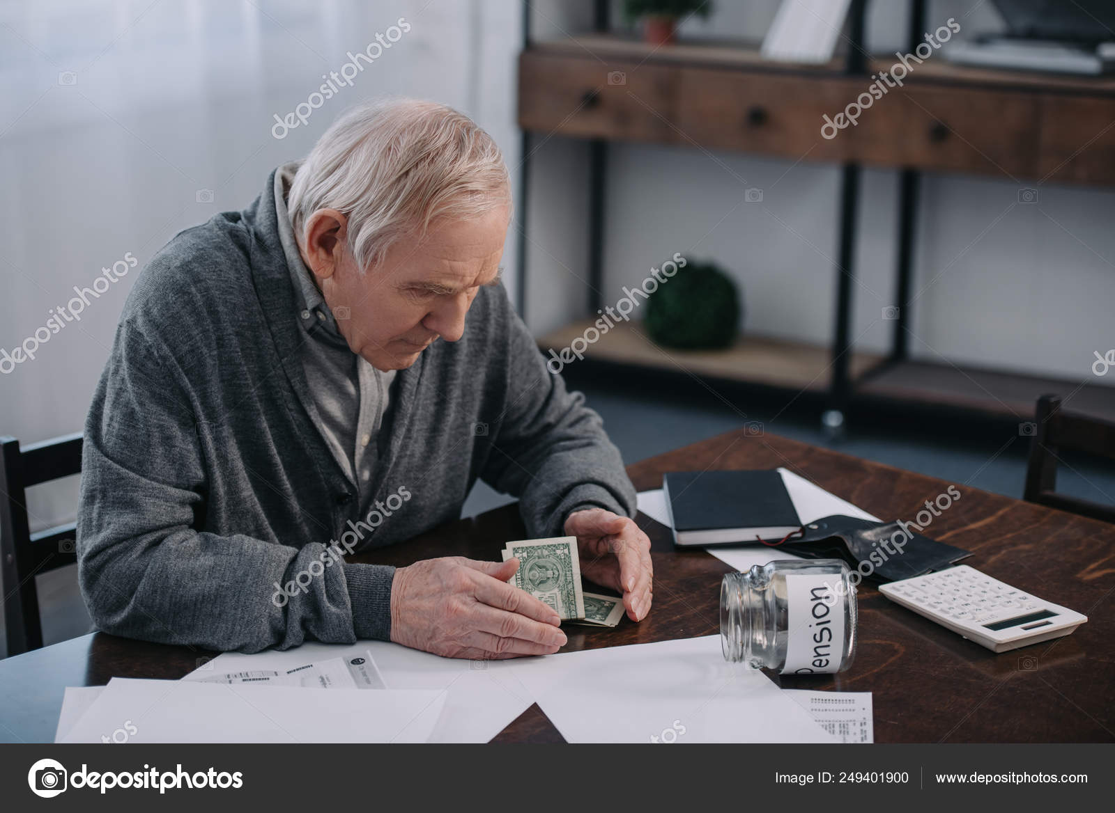 Man Sits On Glass Jar