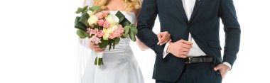 cropped view of bride with wedding bouquet, and groom in black suit isolated on white clipart