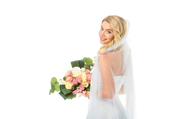 beautiful bride holding wedding bouquet and looking at camera isolated on white