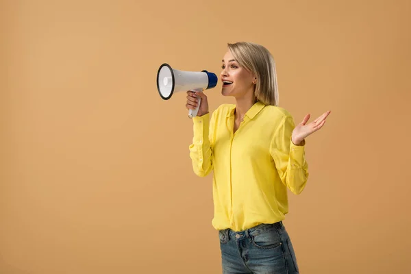 Smiling Blonde Woman Yellow Shirt Screaming Megaphone Isolated Beige — Stock Photo, Image