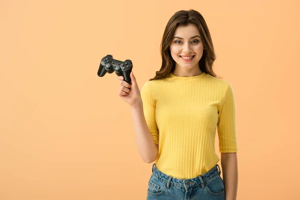 Joyful Brunette Girl Holding Gamepad Smiling Isolated Orange — Stock Photo, Image