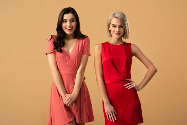 Beautiful Smiling Women Red Dresses Looking Camera Isolated Beige — Stock Photo, Image