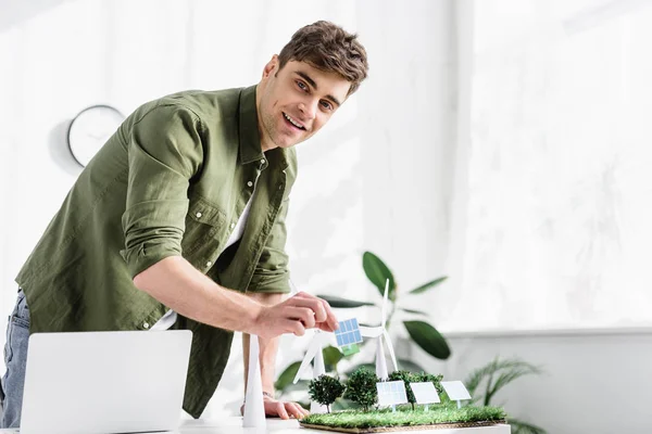 Handsome Architect Standing Putting Solar Panel Model Grass Trees Windmills — Stock Photo, Image