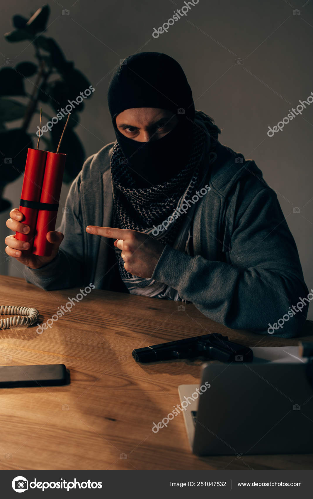 Angry Terrorist Mask Pointing Finger Dynamite Room Stock