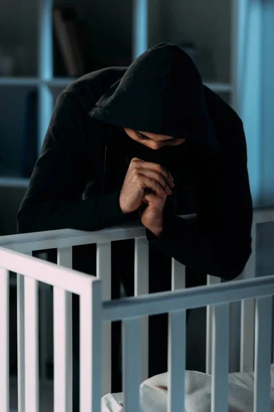 Kidnapper Black Hoodie Looking Crib Showing Please Gesture — Stock Photo, Image