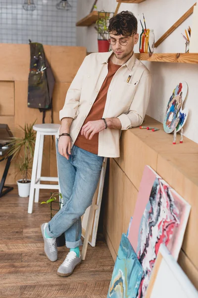 Pensive Handsome Artist Standing Painting Studio Looking — Stock Photo, Image
