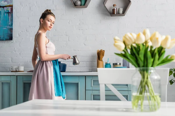 Selective Focus Young Woman Preparing Coffee Cezve Kitchen Table Bouquet — Stock Photo, Image