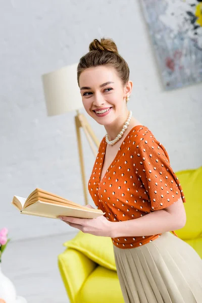 Attractive Smiling Elegant Young Woman Holding Book Looking Away — Stock Photo, Image