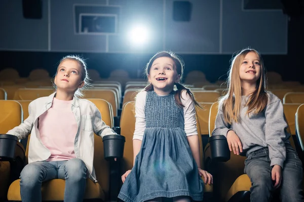 Three Adorable Smiling Kids Watching Movie Cinema Together — Stock Photo, Image
