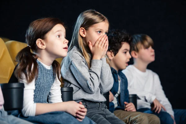 Cute Child Holding Hands Face While Watching Movie Multicultural Friends — Stock Photo, Image