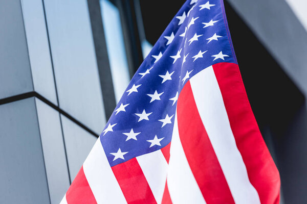 national american flag with stars and stripes near building 