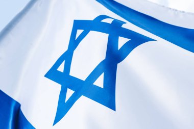 close up of blue star of david on national flag of israel clipart
