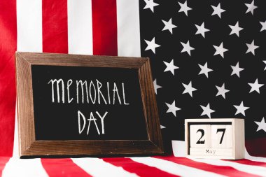 memorial day lettering on chalkboard near cubes with date and flag of america with stars and stripes clipart