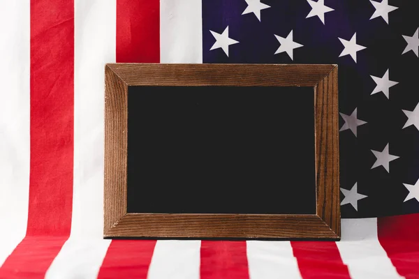empty chalkboard near national flag of america 