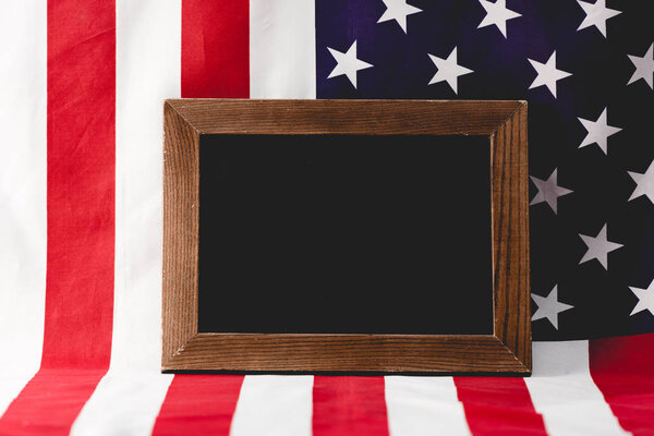 empty chalkboard near national flag of america 