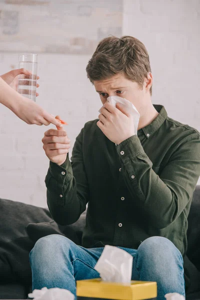 Cropped View Woman Holding Glass Water Pills Man Sneezing Tissue — Stock Photo, Image