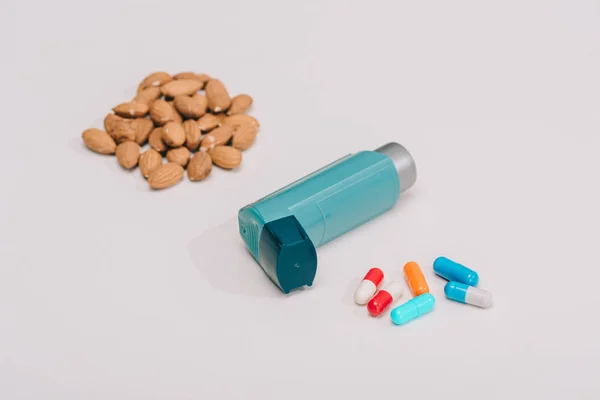 Selective Focus Pills Blue Inhaler Tasty Almonds Grey — Stock Photo, Image