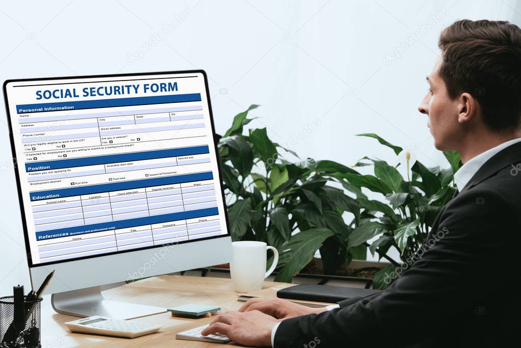 man in suit filling in Social Security Form, Application Concept