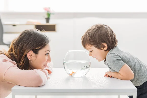 Cheerful Mother Adorable Son Looking Fish Bowl Home — Stock Photo, Image