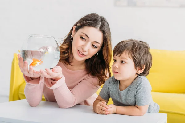 Pretty Woman Holding Fish Bowl Bright Gold Fish Adorable Son — Stock Photo, Image